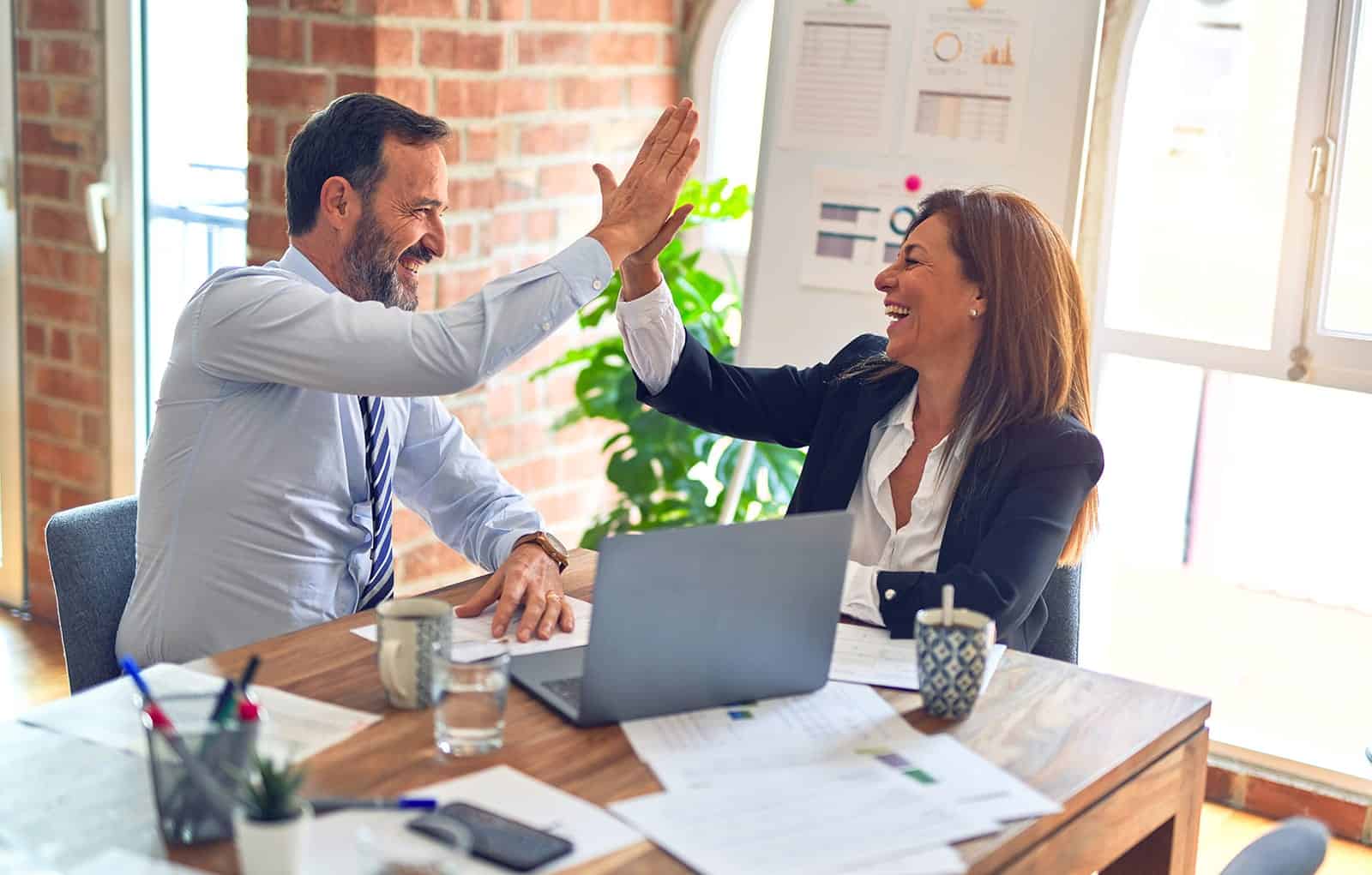 Team of professionals discussing compensation in a modern office